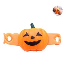 an orange plastic pumpkin belt with black eyes