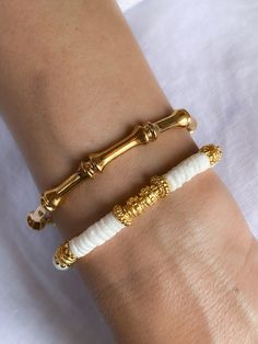 OVERVIEW: Material: 24k gold plated pewter Dimensions: One size - Slightly Adjustable (Don't press hard to extend or squeeze the bracelet with the risk of breakage) Style: Bamboo pattern bracelet of minimal style. You can style this bracelet with the earrings of the same collection.  See the EARRINGS here:  https://www.etsy.com/listing/1128549629/bamboo-pattern-hoops-gold-medium-size?click_key=c8a17fdb56658ba55059a05f9d95364d420be86a%3A1128549629&click_sum=4b5da186&ref=shop_home_active_30&pro=1&sts=1 Nickel Free All PURE GREEK Jewels are inspired from the ancient greek arts, folkore traditions and world cultures. Our jewelry are handmade with love and imagination so you can enjoy unique creations. KEEP SHOPPING Return to my main page shop here: https://www.etsy.com/shop/PureGreekSandals?re Dope Jewelry Accessories, Faberge Jewelry, Bamboo Pattern, Boho Chic Bracelets, Pattern Bracelet, Trending Bracelets, Bracelet Minimalist, Chic Bracelet, Gold Plated Bangles