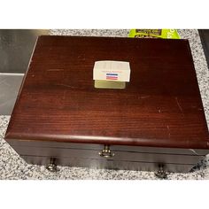 a wooden box sitting on top of a counter