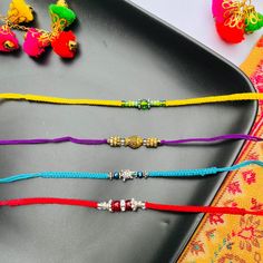 Celebrate the bond of love and protection with our modern, minimalistic handmade rakhis that are perfect for year-round wear! Introducing our exclusive collection of handmade rakhis, crafted with 100% bright colored cotton thread, designed to add a touch of elegance to your Raksha Bandhan celebration. Our rakhis are the perfect blend of tradition and modernity, offering a sleek, non-bulky design that men can comfortably wear all year round. Each rakhi in our collection is a testament to quality Adjustable Multicolor Navratri Bracelets, Adjustable Multicolor Bracelets For Navratri, Adjustable Multicolor Bracelets For Diwali, Traditional Beaded Friendship Bracelets, Adjustable Bracelets For Navratri As A Gift, Adjustable Bracelets For Navratri Gift, Adjustable Bracelets For Diwali Gift, Multicolor Bracelets As Diwali Gifts, Traditional Friendship Bracelets With Adjustable Cord