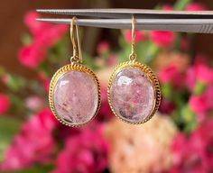 Pink Tourmaline Drop Earrings in 18k Yellow Gold, Statement Earrings, Bridal Earrings, Wedding Earrings These breathtaking Mid-Century earrings feature pink tourmaline gemstones in 18 karat yellow gold. Two (2) 12.11 carat tourmalines, each with a rose pink hue, are set in engraved bezels. Photogenic and fabulous! Shop More Drop Earrings. PRIMARY STONE Stone: Natural Pink Tourmaline Measurements: 18.93 mm x 14.24 mm x 5.30 mm = 12.11 ct (2) Weight: 24.22 ct Shape: Cabochon CHARACTERISTICS Measurements: 1.25 inch in length x 17.17 mm wide Era: Mid-Century 1940's-1960's Composition: 18 Karat Yellow Gold Total Gram Weight: 3.9 g -- ALL PIECES ARE SUBJECT TO PRIOR SALE DUE TO HAVING A RETAIL LOCATION. -- 10-DAY RETURN POLICY FREE SHIPPING TO THE CONTINENTAL UNITED STATES CONTACT OUR SHOP AT 61 Heirloom Gemstone Earrings For Wedding, Mid Century Earrings, Gold Statement Earrings, Earrings Wedding, Tourmaline Gemstone, Pink Tourmaline, Wedding Earrings, Bridal Earrings, Rose Pink