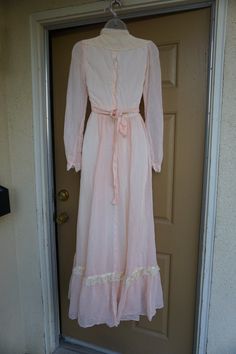 "Pink Gunne Sax prairie dress. No size labeled but fits small maybe 3-5? - Please see measurements to ensure fit. Zips at the back. Adjustable tie at waist. Condition - has small tear on inside lining - see last photo. Measurements taken across front laid flat 15.5\" across front armpit to armpit 12.5\" across front of waist (ties tighter) 57\" length" Vintage Lace Maxi Dress For Daywear, Fitted Maxi Length Prairie Dress, Pink Floor-length Maxi Dress For Daywear, Vintage Prairie Dress Maxi Length, Vintage Empire Waist Maxi Dress With Lace Trim, Vintage Full Length Daywear Dress, Feminine Fitted Maxi Vintage Dress, Vintage Full Length Dress With Lace Trim, Vintage Maxi Prairie Dress For Daywear