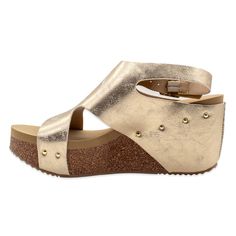 PRICES MAY VARY. Faux leather or metallic faux leather upper with metal buckle closure and studd accents Synthetic lining Signature ultra comfort EVA insole Cork 2.75” wedge with rubber traction outsole Volatile Shoes, Athletic Sandals, Ankle Strap Wedges, Sandals Casual, Pool Side, Casual Sandals, Wedge Sandal, Mid Heel, Wedge Sandals