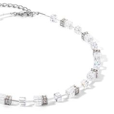 GeoCUBE® Iconic Nature necklace silver-white: timeless elegance in its purest form Experience classic beauty redefined with the GeoCUBE® Iconic Nature necklace in silver-white. This necklace combines the cool shine of silver-coloured stainless steel with colourless crystals and the fascinating, cracked rock crystal cubes. The result is a piece of jewellery that perfectly combines timeless elegance and modern sophistication. Whether as an everyday highlight or for special occasions, this necklace is the epitome of a stylish classic that never goes out of fashion. The simple colour palette combined with the unique texture of the rock crystals creates a subtle yet effective look that underlines your individuality. Discover the GeoCUBE® Iconic Nature Necklace Silver-White - a must-have for any Beauty Redefined, Nature Necklace, Back Necklace, Ring Watch, Crystal Necklace Pendant, Mens Essentials, Rock Crystal, Classic Beauty, Gemstone Bracelets