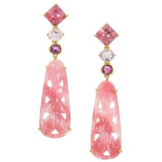 One-of-a-kind carved pink opal, sapphire and tourmaline drop dangle earrings, handcrafted in 18 karat yellow gold. 2.44 inches or 62 mm length. These uniquely carved pink opals are combined with sparkling sapphires and tourmalines to create an exquisite pair of classic yet modern earrings. Feminine and interesting, these elegant and beautiful earrings exude a touch of class. Pink Opal Earrings, Opal Drop Earrings, 1st Dibs, Tourmaline Earrings, Drop Dangle Earrings, Crown Jewels, Women Diamond, Yellow Gold Earring, Opal Earrings