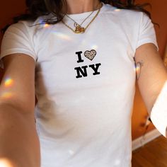 I Love New York with Cheetah Print Y2K Baby Tee!  This comfy aesthetic NYC 90s and Y2K shirt is be a great gift for yourself or a friend. Teenage Girl Gifts, 16th Birthday Gift, Trendy Graphic Shirt, Gift from Aunt to Niece, Gift for Teen Girl. Thank you for choosing to shop on Etsy and finding Lucky Threads Design Co. Each item in our collection has been designed with care and a touch of fun, with the goal of making you feel confident and stylish. If you're lucky, you'll find something that res Nyc 90s, New York 90s, Animal Print Y2k, 90s Nyc, Comfy Aesthetic, Y2k New York, Aesthetic Nyc, Pink Cheetah Print, Baby Tees Y2k