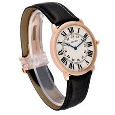 Cartier Ronde Louis Rose Gold Silver Dial Mens Watch W6800251. Manual winding movement. 18k rose gold case 36.0 mm in diameter. Exhibition case back. Circular grained crown set with the blue sapphire cabochon. . Scratch resistant sapphire crystal. Silvered grained dial. Painted black roman numerals. Apple shaped blued steel hands. Secret cartier signature at VII. Black leather strap with the 18K rose gold deployant buckle. Yellow Gold Business Watch, Classic Yellow Gold Watch Bands With Round Dial, Cartier Chronometer Watch Accessories In Yellow Gold, Cartier Yellow Gold Chronometer Watch Accessories, Classic Yellow Gold Watches For Formal Occasions, Formal Yellow Gold Round Watch, Classic Yellow Gold Watch Bands, Yellow Gold Business Diamond Watch, Formal Yellow Gold Round Watch Bands