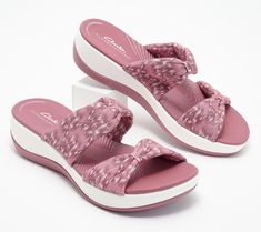 Is a trip to the shore in your future? Slip into these supremely comfortable slides and you're ready for a day of boardwalk strolls and sightseeing. From Clarks Footwear.\n\nOriginal item is A574855. This product may be a customer return, vendor sample, or on-air display and is not in its originally manufactured condition. It may not be new. In some instances, these items are repackaged by QVC. Slip On Sandals, Sandals For Sale, Head Wrap, Head Wraps, Slide Sandals, Slip On Sandal, Slides, Fashion Shoes, Slip On