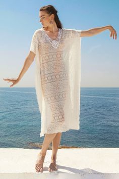 Boho white beach dress, Festival lace dress White Kaftan Dress White maxi kaftan dress made with premium lace. Features a macrame beaded knot on the cleavage creating the perfect V-shape. Its' flowing shape will flatten every silhouette. Details : • 100% cotton lace • Flowy shape • Beaded details • Hand wash recommended • Handmade in Greece https://www.etsy.com/shop/VictoriaHaitoglou White Kaftan Dress For Women, Crochet Lace Beach Dress, White V-neck Crochet Dress For Beach, Lace Maxi Dress For Beach Cover-up, Flowy Lace Patchwork Beach Dresses, V-neck Maxi Dress With Lace Patchwork For Beach, Summer Dress With Lace Trim For Beach, V-neck Lace Patchwork Maxi Dress For Beach, Elegant Lace Maxi Dress Beach Cover-up