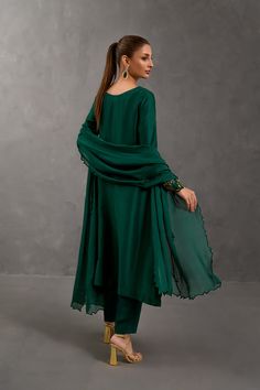 SKU: 1025 Price for Shirt and inner only.Amongst the deepest shade of green this stunning creation is crafted using the finest raw silk adorned with beautiful French knots work further garnished with lovely pearls and sequins. Paired with a same-toned dupatta to complete the look. Green Raw Silk Sets For Party, Green Raw Silk Salwar Kameez With Mirror Work, Formal Green Salwar Kameez With Sheer Dupatta, Formal Green Kurta With Dupatta, Elegant Designer Green Kurta, Elegant Green Designer Wear Kurta, Elegant Green Kurta For Eid, Elegant Green Formal Kurta, Green Silk Sets With Dabka Detailing