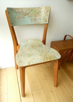 a wooden chair with a map on it