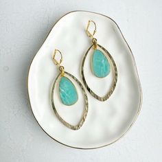 Elevate your style with these Amazonite Marquise Dangle Earrings in brushed gold. Perfect statement earrings for any occasion, these geometric gold earrings add a touch of elegance to your look. Discover your new favorite pair of gold jewelry today! Gold Dangle Earrings