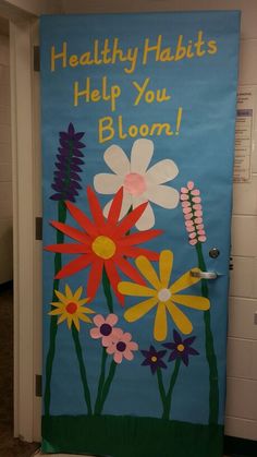 a door decorated with flowers and the words healthy habitts help you bloom