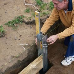 a man measuring the height of a wooden post