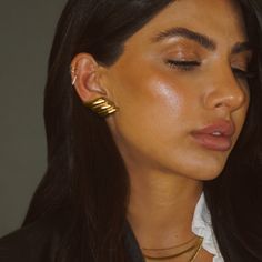 These earrings could adorn any festive ensemble with a hint of heavenly sophistication. Elevate your style with these limited edition gold twist earrings—a favorite among trendsetters. Crafted for lasting elegance and built to withstand your everyday, these statement pieces are a chic must-have for the season Water-resistant, sweat-proof, hypoallergenic and tarnish-free. You can work out in our durable jewelry, wear it to the beach, pool or even shower with it. Chic Gold Plated Clip-on Earrings For Formal Occasions, Elegant Gold Clip-on Plug Earrings, Chic Tarnish Resistant Clip-on Earrings For Formal Events, Chic Formal Clip-on Earrings Tarnish Resistant, Classic Gold-plated Tarnish-resistant Ear Cuff, Glamorous Yellow Gold Earrings For Party, Chic Formal Plug Earrings, Chic Gold-plated Drop Clip-on Earrings, Chic Gold Plated Drop Clip-on Earrings