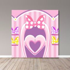 a pink wall with a heart in the center and two bows on it's head