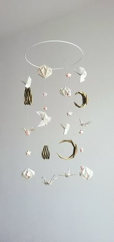 an origami mobile hanging from the ceiling