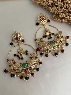 Traditional Punjabi jadau earrings . very lightweight earrings .  Style tip- ----------- Pair it with any beautiful traditional outfits  and flaunt with Unique style of collection from us. Perfect match for Festival and Traditional wear.  Take Care Tips-  ---------------- Kee away from perfume, Hair spray and. Moisture.  Store in dry place , Ziplock bag or Airtight box.    Clean with dry cloth.  Jewellery is the last thing you should wear and first thing you should remove.  ------------------------------------------------ For customers outside Canada-  Some Countries apply import Duties and Taxes on goods which will be paid by customers . Please check your local regulations for more information. Please message me if anyone inquire about product.  Happy shopping  Thank you for supporting my Luxury Traditional Beaded Earrings For Gift, Luxury Traditional Beaded Earrings As Gift, Luxury Kundan Danglers As Gift, Green And Pink Jewellery Set, Green Tikka Jewelry, Jadau Set, Jadau Earrings, Cloth Jewellery, Ziplock Bag