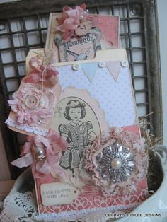 a close up of a small card with buttons and laces on it's side