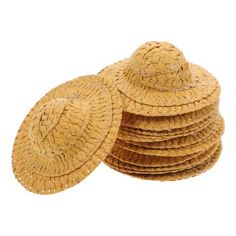 straw hats are stacked on top of each other