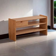 a wooden shelf sitting on top of a tile floor next to a door and window