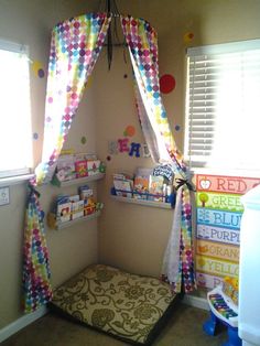 a child's playroom with colorful curtains and toys on the shelves in it