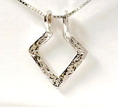 "Geometric Ring Holder Necklace, Sterling Silver, can choose an 18\", 20\" or 24\" sterling silver chain. Is a two-in-one necklace; one side is textured, the other side is smooth. A great way to wear rings when you can't have them on your hands. Ring necklace holders are also a meaningful way to wear the ring of someone dear to you. The Geometric Ring Holder pendant is approx. 22mm x 29mm or 7/8\" x 1 1/8\" (rings not included). It is one solid piece; no open ends nor soldered points. As with ha Ring Keeper Necklace, Ring Necklace Holder, Wedding Ring Necklace Holder, Necklace Ring Holder, Wedding Ring Necklace, Necklace Holders, Ring Holder Pendant, Gold Stacking Rings Wedding, Gold Band Engagement Rings