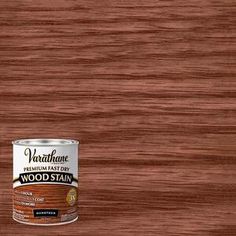 a can of wood stain sitting on top of a table