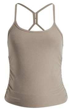 Shirred sides flatter a growing baby bump in this quick-drying racerback tank cut from buttery-soft fabric for comfort in and out of the gym. 23 1/2" length (size Medium) Scoop neck Built-in shelf bra 87% polyester, 13% spandex Machine wash, tumble dry Imported