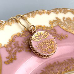 Beautiful and elegant victorian china!  Broken china jewelry is a lovely traditional china gift to celebrate your 20th wedding anniversary with your wife. She will love her handmade jewelry carved from vintage china and set in 14k solid gold!  Our handmade and repurposed china pendant is 7/8" round. From top of bail to bottom of pendant is 1 3/8" tall. Have questions or want more photos? I'll be happy to provide them. DinnerWear Jewelry® ~ Specializing in one of a kind pieces since 1998. Our individually hand crafted pieces are 100% guaranteed. SHIPPING : We ship worldwide from the USA. Expedited shipping available upon request. Free shipping in USA.  JOIN THE DINNERWEAR FAMILY!  Our monthly newsletter features special Etsy sales and incredible custom order stories. Copy this link into you Ceremonial Rose Gold Round Jewelry, Antique Rose Gold Jewelry For Ceremonial Occasions, Vintage White Jewelry For Ceremonial Occasions, Vintage Gold Jewelry For Wedding Gift, Elegant Ceremonial Cameo Jewelry, Vintage Etched Rose Gold Jewelry, White Heirloom Jewelry For Ceremonial Occasions, Heirloom White Jewelry For Ceremonial Occasion, Vintage Rose Gold Etched Jewelry