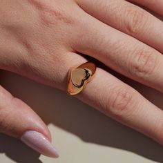 The timeless Girlfriend Signet Ring combines classic sophistication with playful spirit. The curved thick band is molded to a statement heart shape, which offers a refined aesthetic sure to be admired. The 18-karat gold filled ring is electroplate finished to provide a luxe and long-lasting finish, able to withstand water and more! Classic Everyday Heart Ring For Valentine's Day, Elegant Tarnish Resistant Open Heart Ring, Classic Heart Shaped Rings For Everyday, Classic Gold Heart Ring For Everyday, Classic Heart-shaped Rings For Everyday, Trendy Open Heart Ring For Valentine's Day, Dainty Gold Heart Ring Tarnish Resistant, Elegant Everyday Heart-shaped Ring, Tarnish-resistant Open Heart Promise Ring