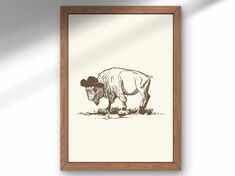 a drawing of a cow with a cowboy hat on it's head in a frame