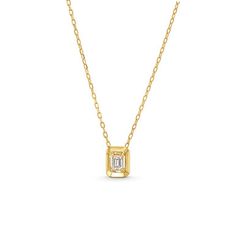 This Emerald Gold Frame Solitaire Pendant Necklace features an emerald cut diamond totaling approximately 0.21 carats framed in 18K yellow gold. Elegant Emerald Cut Diamond Necklace With Baguette Diamonds, Elegant Emerald Cut Baguette Diamond Necklace, Elegant Rectangular Emerald Necklace, 14k Gold Necklace With Emerald Cut Diamond Accents, Elegant Emerald Cut Baguette Diamond Necklaces, Timeless Gold Solitaire Necklace With Emerald Cut, Classic Yellow Gold Emerald Cut Necklace, Yellow Gold Baguette Cut Fine Jewelry Necklaces, Yellow Gold Baguette Cut Fine Necklaces