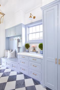 the instagram page for instagram's website shows an image of a bathroom with white cabinets and checkered flooring