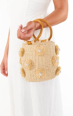 We are crazy about this gorgeous straw bag featuring beautiful raffia, pearl details & a circle handle. Take her anywhere, she's perfect for all occasions. Chic Natural Straw Bag With Round Handle, Chic Woven Beach Bag With Round Handle, Chic Jute Straw Bag With Round Handle, Cream Handheld Straw Bag For Spring, Handheld Cream Straw Bag For Spring, Summer Cream Bag With Pearl Handle, Cream Bag With Pearl Handle For Summer, Cream Woven Straw Bag For Day Out, Chic Spring Beach Bag With Round Handle