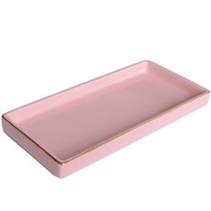 a pink rectangular tray with gold trim