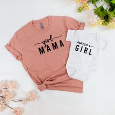 Girl Mama Shirts, Girl Mama Tees, Mama's Girl Onsie, Mama's Girl Custom Onsies, Custom Baby Onsies, Mom and Son Matching Shirt, Mom Shirt, Baby Shower Gift, Mama T shirt, Mini Onsie, Mini Toddler, Mini Youth, New Mom Gift Idea, Mama Baby Shirts, Mom and Baby Shirts, Baby Onsie, Mom and Daughter Set, New Mom Gifts, Baby Girl Onsies, Daughter Onsies Do you have a momma's girl? Mom and daughter shirts are the sweetest and our mommy and me shirts are a great way to match your little one. Looking to Unisex Pink Top With Name Print, Cute Cotton Tops With Name Print, Mother's Day Matching Cotton Tops, Matching Cotton Tops For Mother's Day, Pink Matching Tops For Mother's Day, Matching Cotton Shirt With Name Print, Pink Short Sleeve Family Matching Shirt, Pink Tops With Text Print For Mother's Day, Unisex Pink Letter Print Shirt