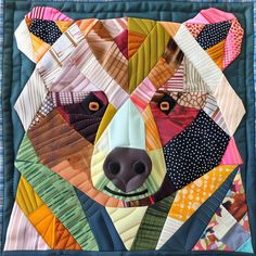 a bear made out of quilts is shown