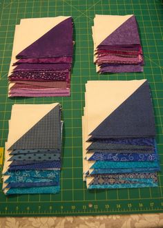 several pieces of fabric laid out on a cutting board