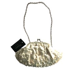 Milami New York Ivory Pearl Evening Bag. Elegant And Absolutely Beautiful Evening Bag. Soft Satin Fabric Accented With Pearls On Front. Silver Hardware, Chain Strap That Can Be Easily Tucked In And Carried As A Clutch Purse. Snap Closure. Lined. Card Slot Inside. Great For Dinners, Cocktails Or Any Special Occasion. Sku:427 Color: Ivory Size: Small Approx: 9"W X 4.75"H, 9"Strap Drop Condition: Nwt. No Issues Material:Satin Check Out My Closet! Lots Of Great Pieces Smoke & Pet Free Home Cream Bags With Pearl Handle For Spring, Cream Bags For Spring Party, Spring Cream Bags With Pearl Handle, Cream Clutch For Events, Cream Clutch Bag For Events, White Evening Bag For Spring Party, Cream Clutch Shoulder Bag For Party, Cream Party Clutch Shoulder Bag, Cream Pouch Bag For Party