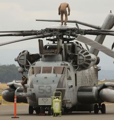 an army helicopter is parked on the tarmac