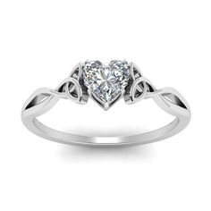 a heart shaped diamond ring with two hearts on the band, set in 18k white gold