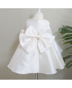 Buy simple satin sleeveless wedding couture flower girl dress with big bow decoration at wholesale price online. Free shipping and pro custom service since 2009. Sleeveless Satin Princess Dress, Elegant Sleeveless Princess Dress For First Communion, Satin Princess Bridesmaid Dress, Princess Style Satin Bridesmaid Dress, Princess Satin Bridesmaid Dress, Sleeveless Satin Princess Dress For Pageant, Sleeveless Satin Princess Wedding Dress, Elegant Baptism Dress With Bow For Party, Sleeveless Baptism Dress With Bow