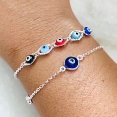 The Evil Eye Bracelet is a captivating and ancient talismanic accessory revered for its protective qualities and striking design. This bracelet features a combination of symbolic elements cherished across cultures for centuries. The Evil Eye Bracelet carries deep symbolic meaning. It is believed to safeguard its wearer from the malevolent glares and envious intentions of others. Item Description: Silver Evil Eye Bracelet Material: 925 Sterling Silver - Blue Evil Eye length: 7.5 inches with 2-inc Symbolic Multicolor Bracelets As Gift, Symbolic Friendship Bracelets, Symbolic Sterling Silver Bracelet Gift, Spiritual Resizable Bracelet For Festivals, Spiritual Hypoallergenic Bangle Jewelry, Adjustable Amulet Bracelets As Gift, Adjustable Amulet Bracelet Gift, Adjustable Evil Eye Spiritual Jewelry, Adjustable Amulet Bracelet As Gift