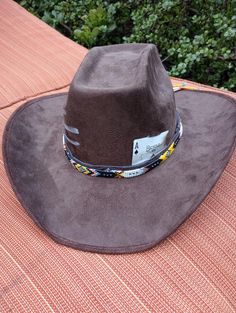 This stiff brim cowboy hats is stylish while keeping the sun out your eyes. These hats come in 3 colors (Brown, Cardinal and Black) and  3 style variants (Card only, Card and Paint, or Card, Paint and Beaded Band). Personalization can be  fulfilled including hat color, painting symbol or choosing playing card or cards (2 cards max). Southern Style Hat With Short Brim For Western-themed Events, Western Style Sun Hat With Flat Brim For Rodeo, Western Brimmed Hat For Kentucky Derby, Western Style Flat Brim Sun Hat For Rodeo, Southwestern Wide Brim Felt Hat For Western-themed Events, Western Wide Brim Felt Hat For Outdoor, Western Style Wide Brim Felt Hat For Outdoor, Western Brimmed Hats For Rodeo, Adjustable Western Felt Hat For Outdoor