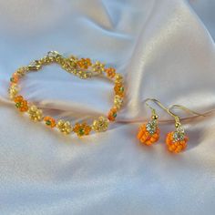 Handmade autumn themed jewellery set made with glass seed beads bracelet and earrings Beaded Pumpkin Bracelet, Orange Faceted Beads For Jewelry Making, Orange Faceted Beads For Crafting, Orange Jewelry With Gold Beads For Gift, Orange Gold Beaded Jewelry For Gift, Orange Beaded Czech Glass Jewelry, Orange Czech Glass Beaded Jewelry, Orange Beaded Bracelet, Pumpkin Bracelet