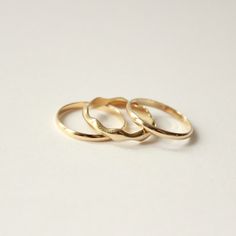 Named after the Ionian Sea in the Mediterranean, the Ionian Ring Stack features our best selling gold band trio. Play with subtle waves of negative space with our Low Tide band set between two of our 2mm bands. This ring stack is the perfect symbol to bring calm to your day to day. Perfect if you’re looking for an alternative wedding ring, or a vow ring for the non-traditional bride. Normally $950 when bought individually, with this set you get all three at a discount. This style is made to orde Heirloom Style Stackable Midi Rings With Round Band, Minimalist 14k Gold Ring With Decorative Band, Minimalist Promise Ring With Decorative Band, Minimalist Yellow Gold Rings With Decorative Band, Minimalist Yellow Gold Ring With Decorative Band, Adjustable Yellow Gold Thick Band Stackable Rings, Adjustable Thick Band Yellow Gold Stackable Rings, Adjustable Thick Band Stackable Rings In Yellow Gold, Classic Hammered 14k Gold Stackable Rings