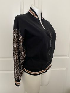 There is nothing like the feel of this Italian Jersey paired with the soft stretchy sparkle sequined sleeves that announce, I’m here! This sassy little jacket tops nearly everything and has all the attitude you need to take you back out into the real world. One size fits up to a 16 Made of 95% Cotton 5% Elastane Made in Italy Waistband hits at the high waistline Collar and waistband made of soft stretched ribbed jersey too Sleeves made of stretch sequins fabric allowing for fit Sequins Fabric, Sequin Fabric, The Real World, Jacket Tops, Call Me, Bomber Jacket, Hollywood, Sparkle, Italy