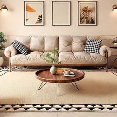 a living room with two couches and three chairs in front of a coffee table