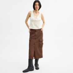 A ‘90s-inspired take on vintage utilitarian styles this maxi cargo skirt is designed with traditional workwear pockets to hold your on-the-go essentials. Crafted of organic cotton made without the use of harmful chemical fertilizers and pesticides the long silhouette is finished with a front vent for added mobility and tie details at the hem. Maxi Cargo Skirt, Sling Bag Mini, Utilitarian Style, Coach Outlet, Cargo Skirt, 90s Inspired, Pesticides, Maxi Skirt, Work Wear